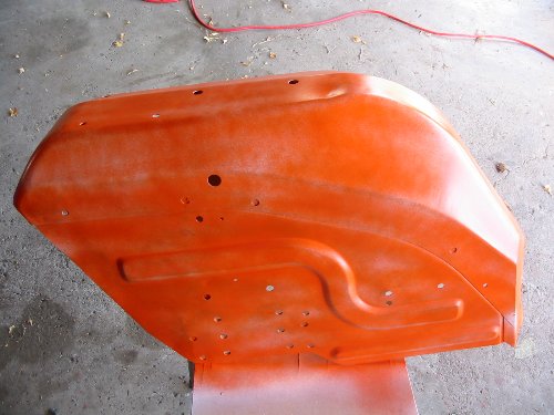 Fender after first coat This is what our fender looks like after the first coat - spotty with primer barely visible in some spots.