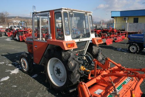 L1-R With Cab An L1-R Kubota equipped with a cab - note the rear glass panel for viewing ground near the PTO and the rear wiper.