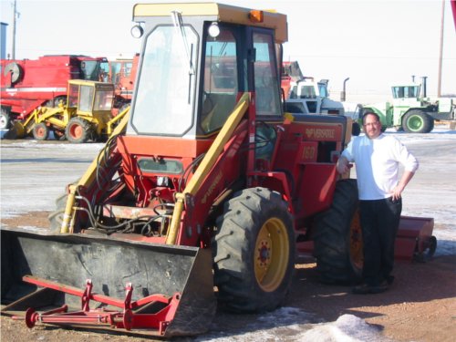 Versatile 160 Service Department Vic standing beside a Versatile 160 bidirectional tractor. Versatile built the 160 from 1982-1983.