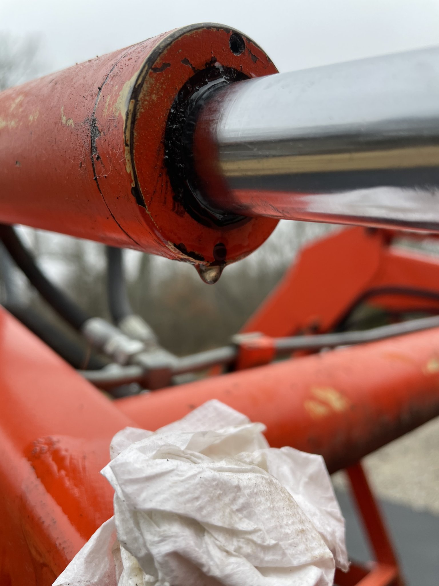 Hydraulic fluid leaking from bucket arm. OrangeTractorTalks