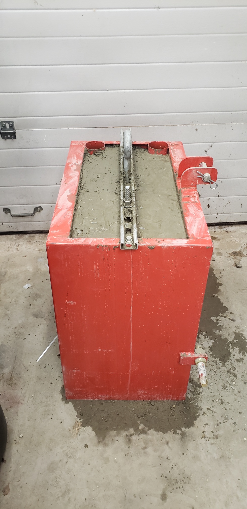 ballast box filled 9 60lb bags concrete.jpg
