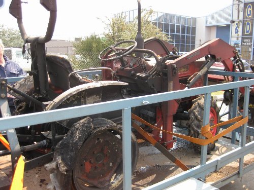 A burned up Kubota L1801 as a result of Australia's recent brush fires making the news.