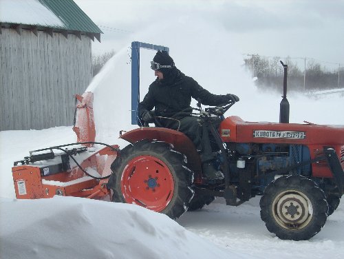 The farm's Kubota L2201 earns its keep - snowblowing, rototilling, hauling or running the irrigation system. 