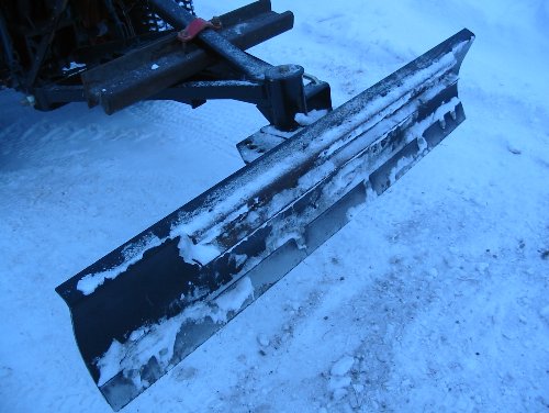 Typical Snow Blade A typical snow blade that has seen some use. This one, manufactured by Farm King, is in "back blade" position and attached to a Kubota B6200.